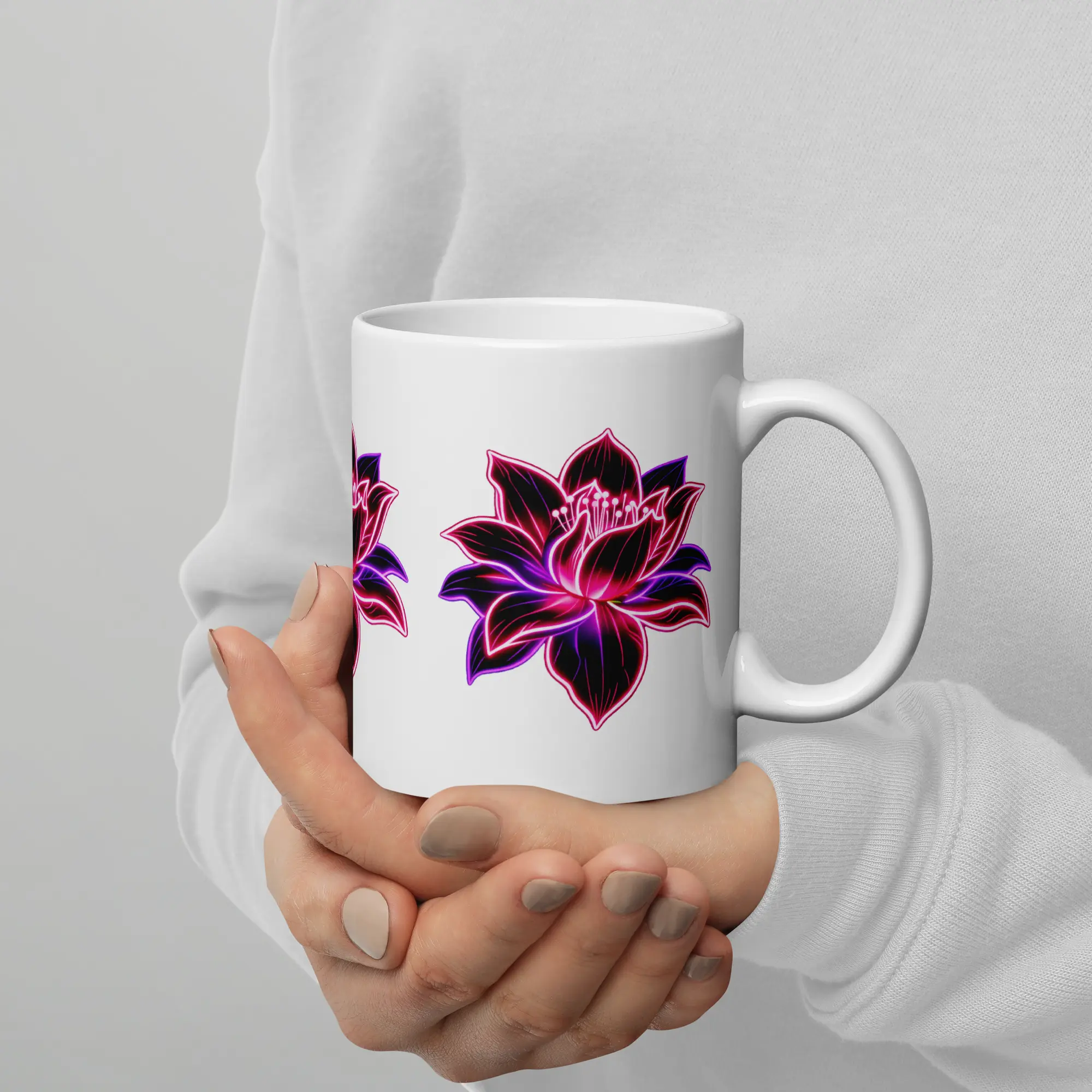 Woman holding a white Neon Lotus mug — warm and magical morning coffee ritual